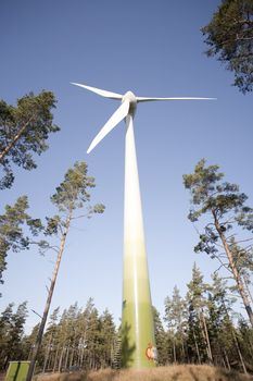 Modern windmill producing renewable energy ecologically.