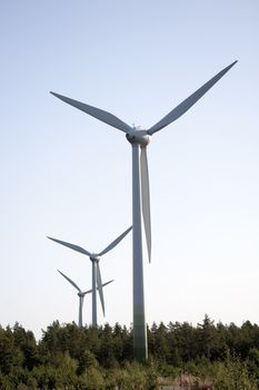 Modern windmill producing renewable energy ecologically.