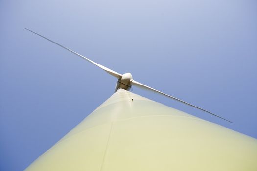 Modern windmill producing renewable energy ecologically.