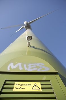 Modern windmill producing renewable energy ecologically.