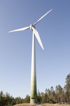 Modern windmill producing renewable energy ecologically.