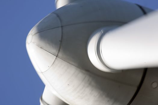 Modern windmill producing renewable energy ecologically.