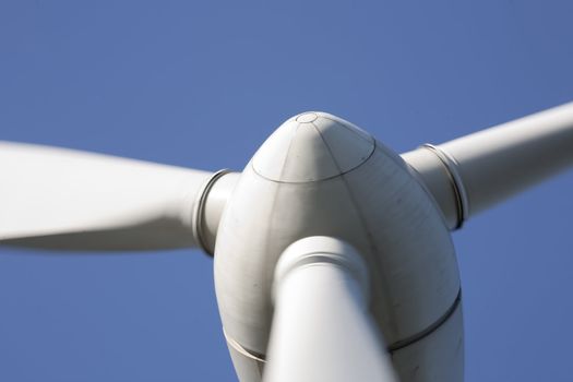 Modern windmill producing renewable energy ecologically.