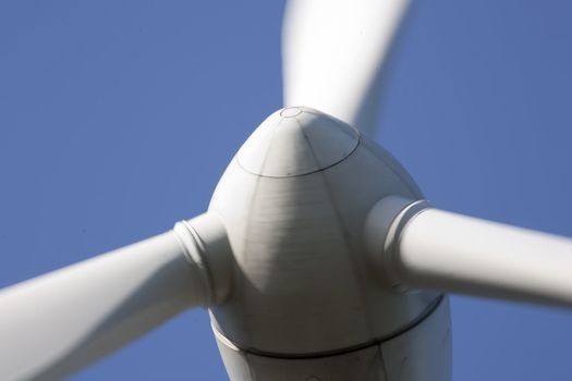 Modern windmill producing renewable energy ecologically.