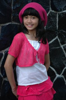 cute asian girl wearing pink hat