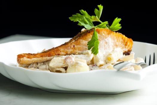 baked salmon on pepper with creamy pasta