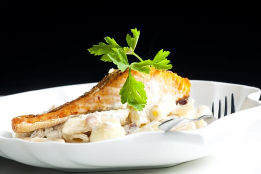 baked salmon on pepper with creamy pasta