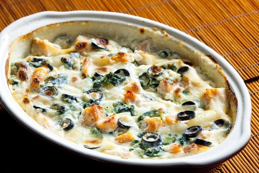 baked gnocchi with salmon, spinach and black olivves