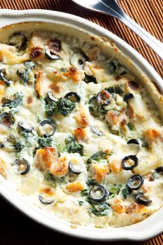 baked gnocchi with salmon, spinach and black olivves