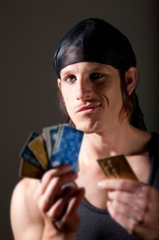 Indentity thief holding many stolen credit cards
