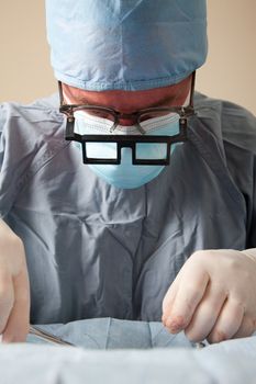 Veterniarian performing spay operation on dog animal not seen