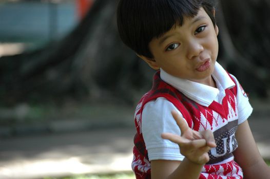 little boy with nice and cute face expression