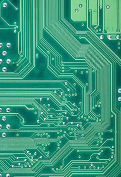 Green industrial texture of a electronic plate with paths