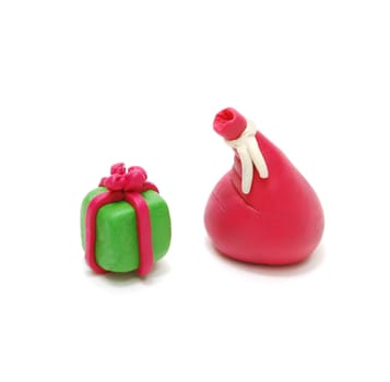 3D Christmas Gift and Red Santa's Sack Made of Plasticine Isolated on White Background