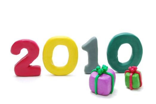 3D New Year Text 2010 Made of Colored Plasticine with Gifts Isolated on White Background