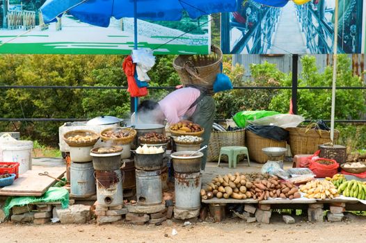 Street vendor in China selling her produce and food