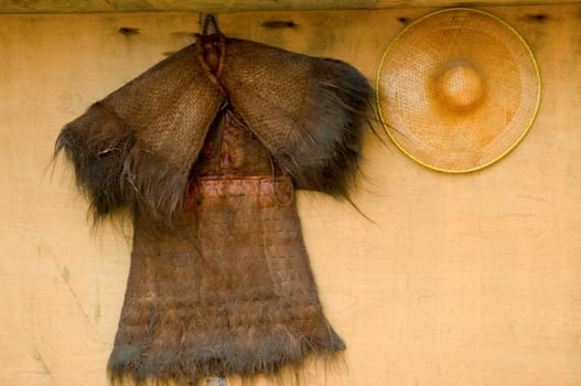 Traditional chinese farmer straw coat and bamboo hat