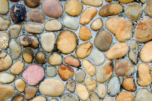 The abstract pattern of wall constructed with pebbles