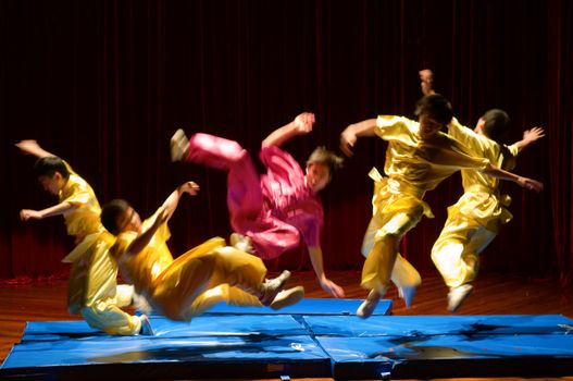 MACAU - APRIL 25: Performing Chinese kung fu (wu shu) with pose of kicking enemies, April 25, 2009, Macau, China