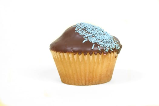 Single chocolate iced cupcake with blue decoration.