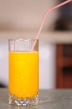 Orange juice in a glass on a table