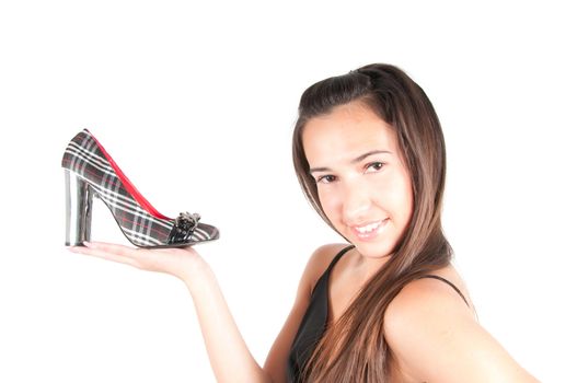 Shot of woman with shoie in studio