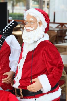 Santa Claus as a performer with musical instruments