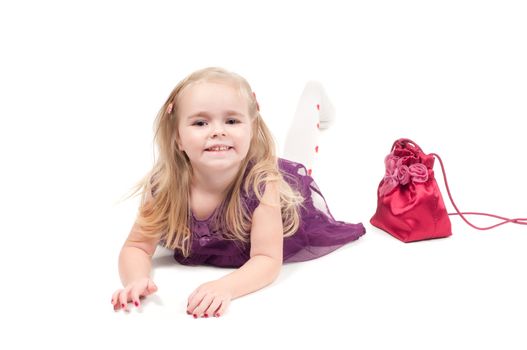 Studio shot of baby girl in lilac gala dress