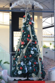 A big Christmas tree with ornaments and lights