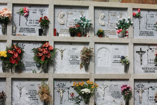 Flowers and stones on a typical Spanish cemetery in Tenerife