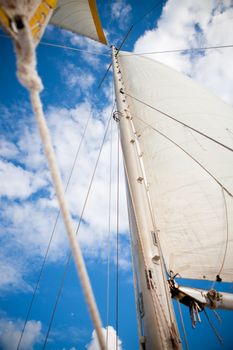 Sail and mast of a touristic boat in Caribbean sea