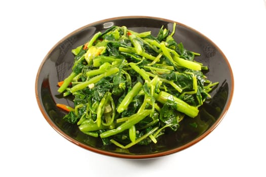Single Serving of Steamed Vegetables on a Black Plate