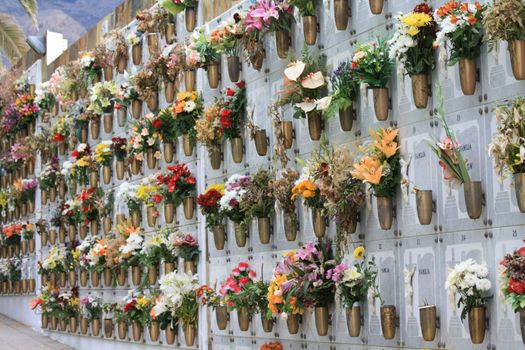 Flowers and stones on a typical Spanish cemetery in Tenerife