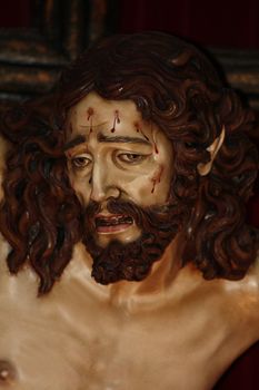 A close up portrait of Jesus on cross in a Spanish church