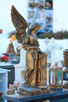 A bronze guardian angel on a Spanish cemetery