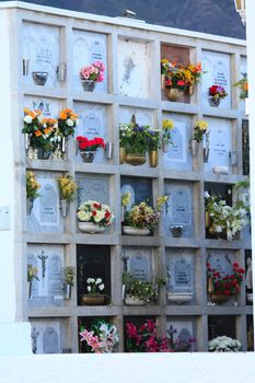 Flowers and gravestones on a Spanish cemetery