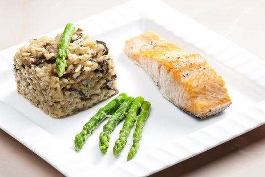 baked salmon with mushroom risotto and green asparagus