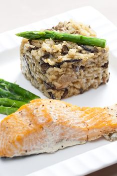 baked salmon with mushroom risotto and green asparagus