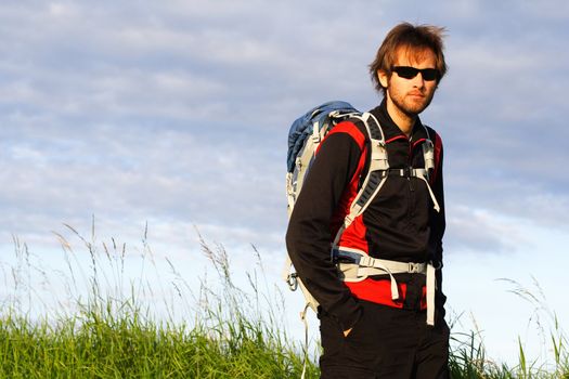 Young male hiker looking at the camera