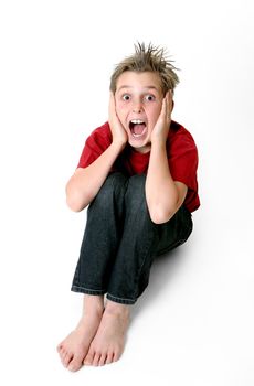 Boy with a shocked expression and hair on end.