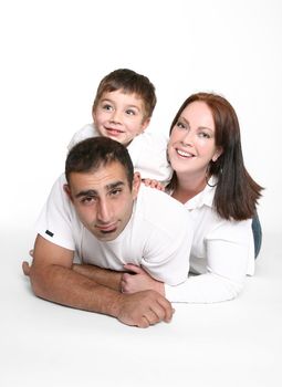 Happy relaxed family lying on floor