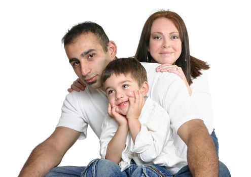 Father, mother and son sitting in jeans on white background