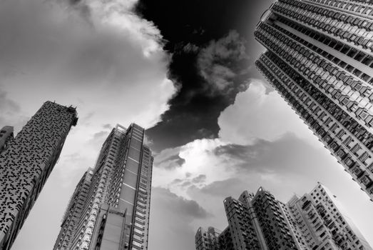 Dramatic high buildings touch sky in Hong Kong.