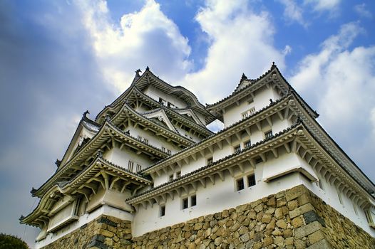 Ancient Samurai Castle of Himeji with Blue Cloudy Sky.  Japan.