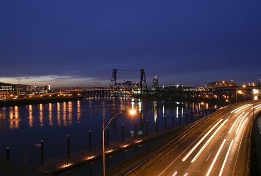 Portland, Oregon view of the Steel Bridge with light reflections on the Willamette River