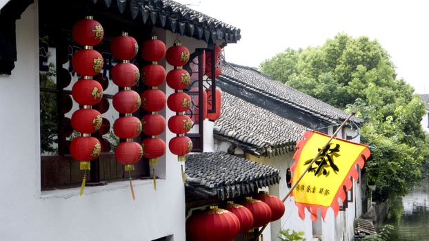 Red lanterns hanging from the ancient architecture