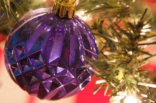 A purple Christmas tree ornament ball