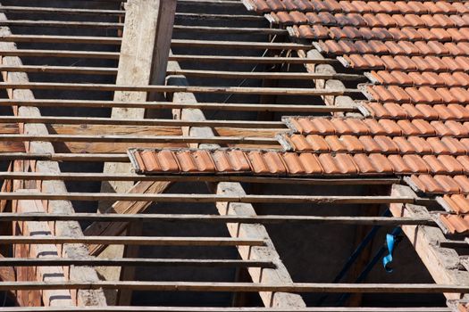 Roof renovation, removing tiles and exposed framework