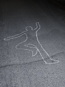 Contour of a person drawn at the asphalt
