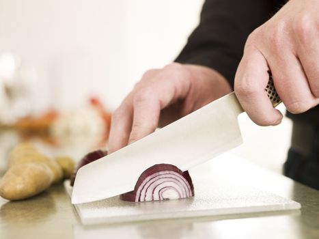 Cutting onion with a knife